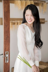 Elegant puff sleeve maxi dress crafted from sheer organza with tailored waistline